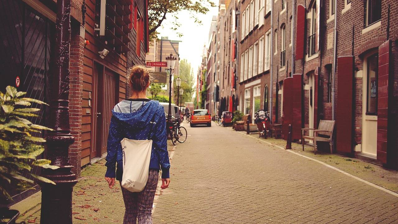 Tourist exploring Amsterdam streets on f