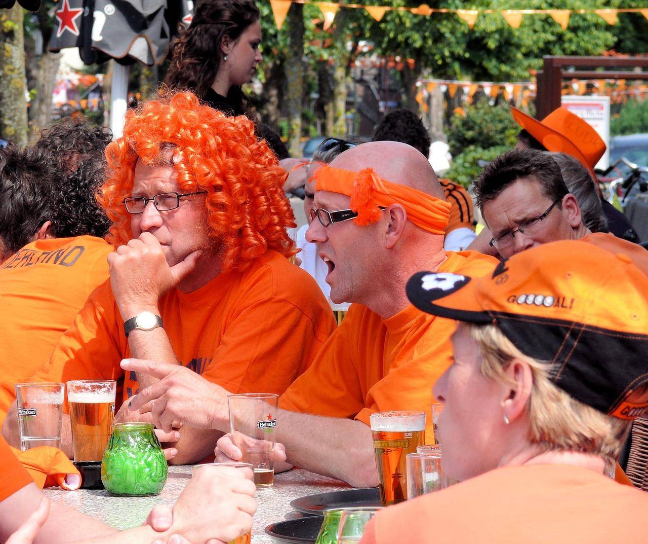 Dutch people drinking Heineken Beer oran