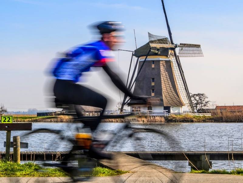Cyclist windmill with river fast_HDR